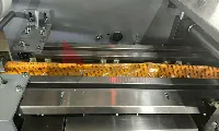 Finished kurkure masala munch packaging line
